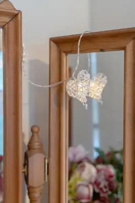a reflection of a christmas ornament in front of a mirror at Foxglove Haven- 3-Bed Detached - Garden - Drive in Longridge