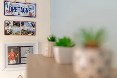 a table with a picture on the wall and some plants at Foxglove Haven- 3-Bed Detached - Garden - Drive in Longridge