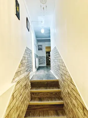 a staircase in a building with brick walls at Specious Liverpool Central Apartment in Liverpool