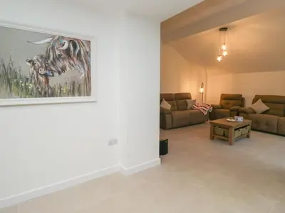 a living room with a couch and a table at Apple Tree Barn in Dalton in Furness