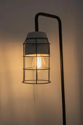 a black lamp with a light in a room at Sevenstay Apartments Fleet Street in Liverpool