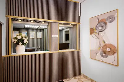 an office with a large window and a vase of flowers at Empire Inn in Blackpool
