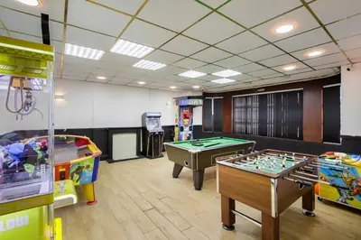 a room with two tables and a pool table at Empire Inn in Blackpool