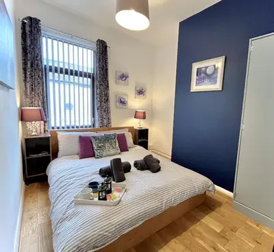 a bedroom with a bed with a tray on it at Modernised 3-bed home in Bamber Bridge, Preston in Bamber Bridge