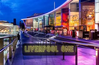 a lit up sign in front of a building at Liverpool Serviced Apartment - Mallow in Liverpool