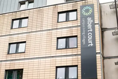 a building with a sign on the side of it at Albert Court in Liverpool in Liverpool