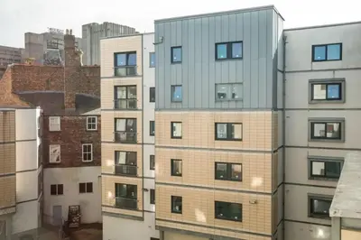 an apartment building with many windows in a city at Albert Court in Liverpool in Liverpool