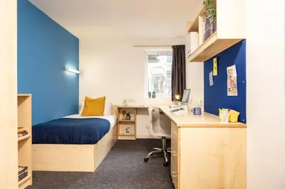 a bedroom with a bed and a desk and a bed and a deskictericter at Albert Court in Liverpool in Liverpool