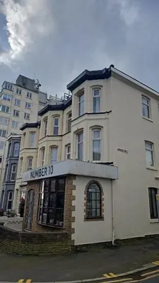 a white building with a sign for a hotel at Number 10 in Blackpool