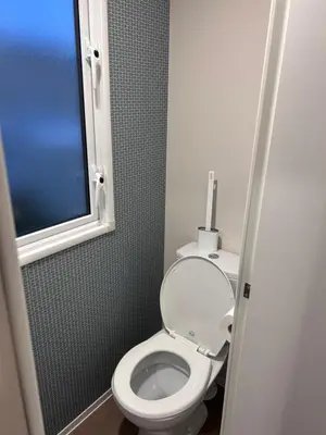 a bathroom with a white toilet and a window at Haven Cala gran 2026 spring summer autumn winter breaks up to January 2027 A full action camp for all ages disabled friendly Fleetwood Blackpool Entire home 6 people seaside caravan park in Fleetwood