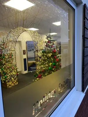 a christmas window with a christmas tree in a store at Haven Cala gran 2026 spring summer autumn winter breaks up to January 2027 A full action camp for all ages disabled friendly Fleetwood Blackpool Entire home 6 people seaside caravan park in Fleetwood