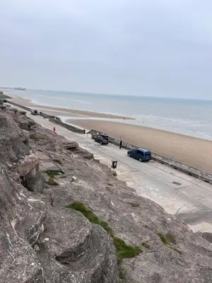 a view of a beach with cars parked on the road at Haven Cala gran 2026 spring summer autumn winter breaks up to January 2027 A full action camp for all ages disabled friendly Fleetwood Blackpool Entire home 6 people seaside caravan park in Fleetwood