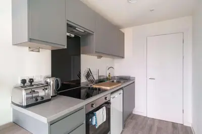 a kitchen with a sink and a stove top oven at Fabulous Studio in Central Liverpool in Liverpool