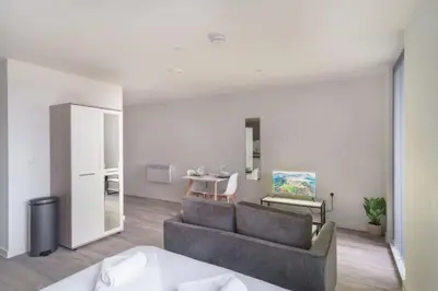 a living room with a couch and a table at Fabulous Studio in Central Liverpool in Liverpool