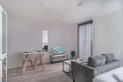 a living room with a couch and a table at Fabulous Studio in Central Liverpool in Liverpool