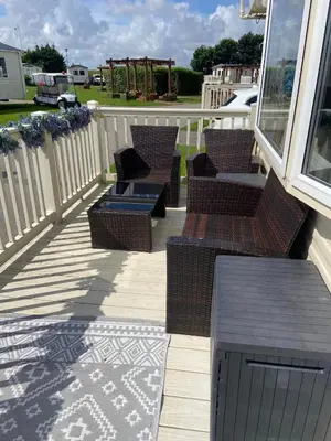 a porch with chairs and a gazebo at Haven Lakeland Caravan Hire in the Lake District in Flookburgh