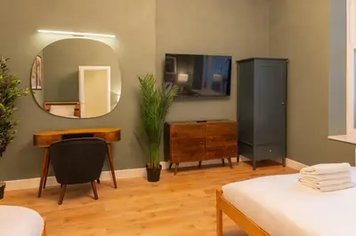 a bedroom with a mirror and a desk and a tv at Host & Stay - The Georgian Quarter at Catharine House in Liverpool