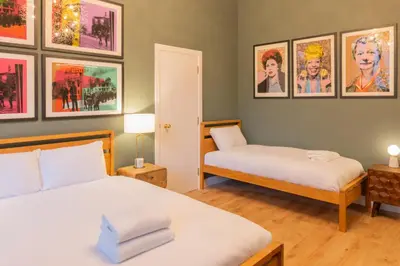 two beds in a room with pictures on the wall at Host & Stay - The Georgian Quarter at Catharine House in Liverpool
