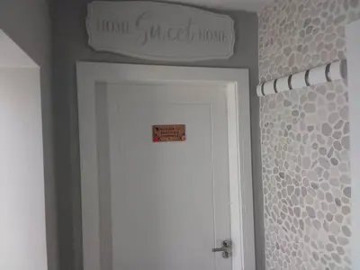 a sign above a white door in a bathroom at Beachview apartment in Cleveleys