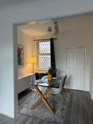 a dining room with a table and chairs at Gertrude house in Saint Helens