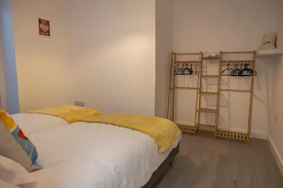 two beds in a room with two ladders at Sunbeam House 1 Morecambe Pet Friendly in Morecambe