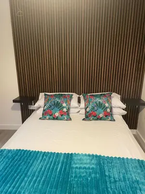 a bedroom with a bed with two pillows at Sunbeam House 1 Morecambe Pet Friendly in Morecambe