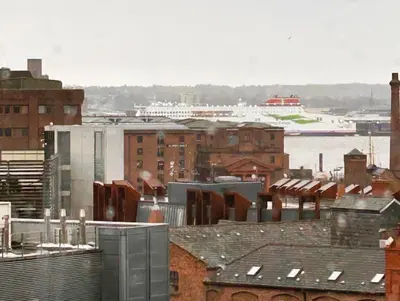 a view of a city with buildings and a harbor at Hillcrest Liverpool City Central in Liverpool