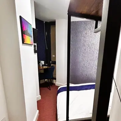 a bedroom with a bunk bed and a desk at Hillcrest Liverpool City Central in Liverpool