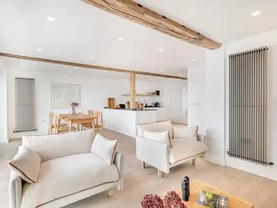 a living room with two white couches and a table at Beach Haven in Arnside