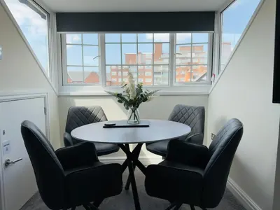 a meeting room with a table and chairs at Lethbridge Villa 49 Apartment 3 Super Fibre WiFi, Free parking in Southport
