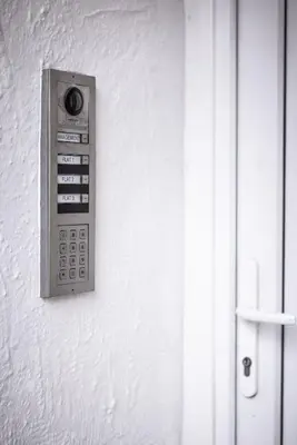 a remote control hanging on a white wall at Lethbridge Villa 49 Apartment 2 Super Fibre WiFi, free parking in Southport