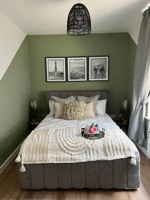 a bedroom with a large bed with a tray on it at Vance Retreat in Blackpool