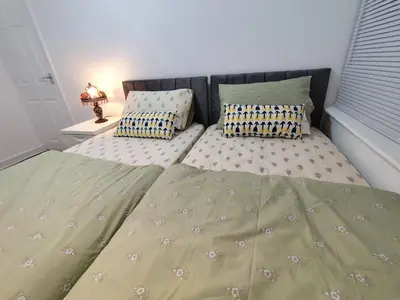 a bed with two pillows on it in a bedroom at Prime Comfort Wigan in Ince-in-Makerfield
