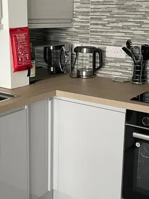 a kitchen with a counter top with a coffee maker at Sunbeam House 2 Morecambe Accessible in Morecambe