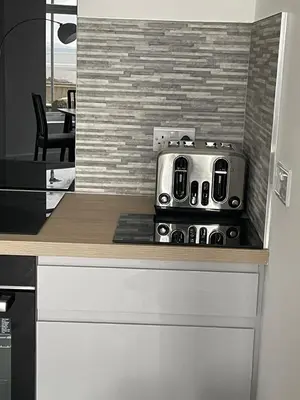 a toaster sitting on top of a kitchen counter at Sunbeam House 2 Morecambe Accessible in Morecambe
