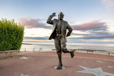 a statue of a man running on the beach at Sunbeam House 3 Morecambe in Morecambe