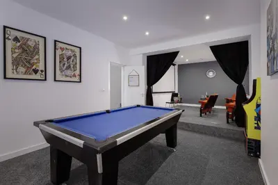 a living room with a pool table in it at Blackpool Abode - Shaw Heights in Blackpool