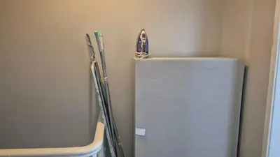 a refrigerator in a room with some tools on it at House next to Anfield Stadium, Goodison Park in Liverpool