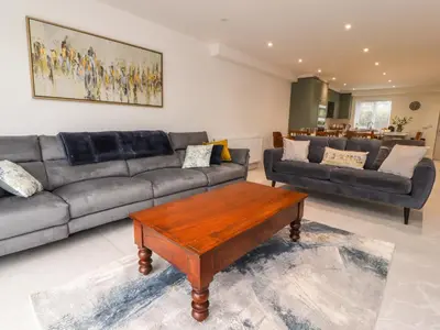 a living room with a couch and a coffee table at Pear Tree Cottage in Preston