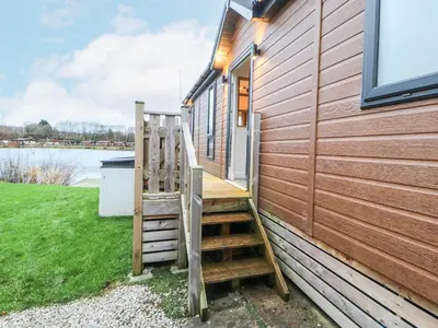 a stairway leading up to a building with a house at 12A Lake Escape in Carnforth