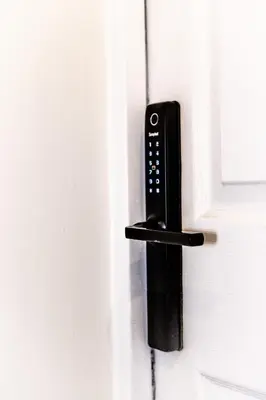 a black door lock on a white door at Lethbridge Villa 49 3-bedroom Apartment with private HOT TUB,Fibre WiFi, free parking, sleeps 6 in Southport