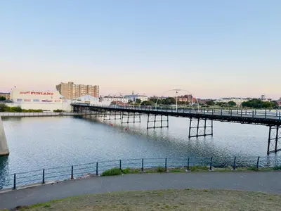 a bridge over a body of water at Lethbridge Villa 49 3-bedroom Apartment with private HOT TUB,Fibre WiFi, free parking, sleeps 6 in Southport