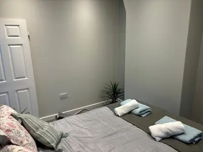 a bed with two pillows on it in a room at Stumps and Bails Families and contractors welcome in Ormskirk