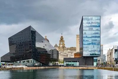 a group of buildings next to a body of water at Stunning Centrally Located Studio Apt in Liverpool