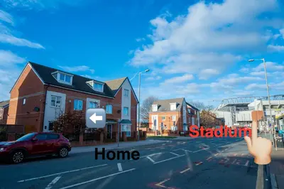 a view of a street with houses and a car at 1 minute walk to Liverpool Stadium Free Private Parking, Anfield Liverpool Entire House in Liverpool