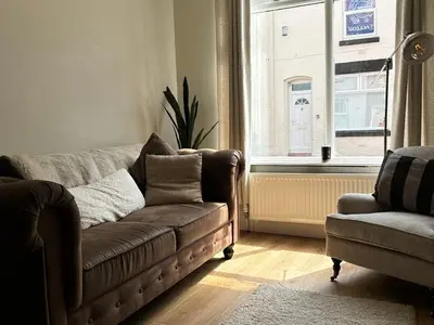 a living room with a couch and a window at 1 min to Everton FC Free Parking, Farmhouse Chic in Liverpool