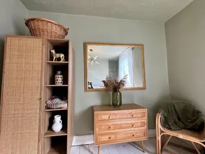 a room with a wooden dresser and a mirror at 1 min to Everton FC Free Parking, Farmhouse Chic in Liverpool
