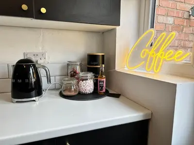 a kitchen counter with a coffeemaker and a coffee maker at 1 min to Everton FC Free Parking, Farmhouse Chic in Liverpool