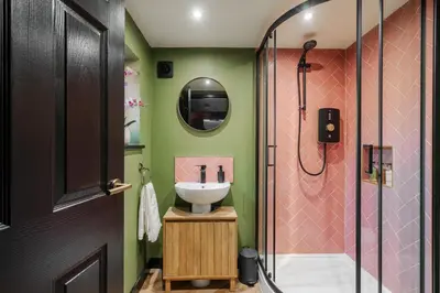 a bathroom with a sink and a shower at The Lodge in Woodplumpton