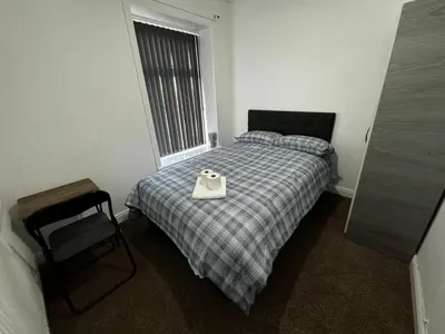 a bedroom with a bed with a tray on it at Double bed BW3 Accrington Burnley in Accrington